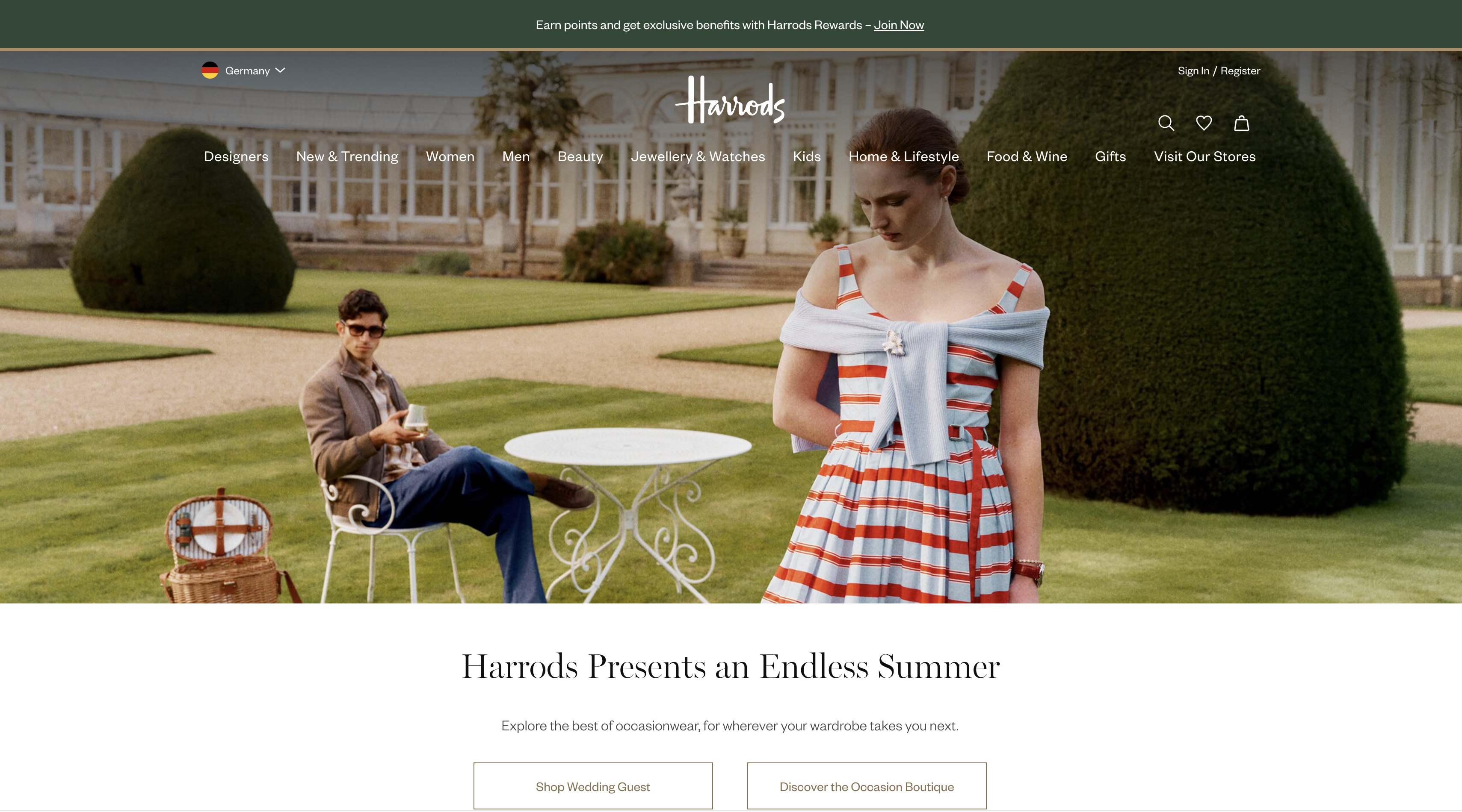 Harrods homepage featuring two fashion models in a summer garden